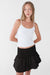Smocked tiered mini skort in black — main image