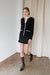 Suiting mini skirt with ruffle hem in black — main image