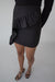 Mini skirt with curved ruffle in black — main image
