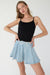 Pleated denim mini skort in light blue — main image
