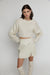 Cropped open back sweater in ivory — main image