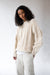 Cable knit crewneck sweater in oatmeal — main image