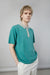 Colour block polo in evergreen seafoam — main image