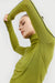 Turtleneck top with contrast trim in olive — main image
