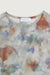 Sheer printed long sleeve top in beige — main image