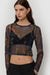 Sheer printed long sleeve top in black — main image