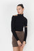Cutout turtleneck top in black — main image