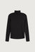 Turtleneck knit top in black — main image