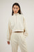 Cropped quarter zip sweatshirt in cream — main image