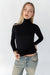 Fine knit turtleneck top in black — main image