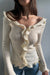 Top with ruffle detail in beige — main image