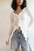 Ruffled v-neck long sleeve top in white — main image