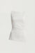 Fitted sleeveless top with asymmetrical hem in cream — main image