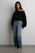 Fleece studio cinched waist off the shoulder sweatshirt in black — main image