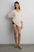Relaxed v-neck drawstring top in beige — main image