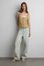 Sheer layered top with piping detail in olive — main image