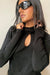 Mockneck top with front cutout in black — main image