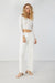 Off shoulder buttoned front top in white — main image