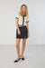 Collared knit top with contrast trims in cream — main image