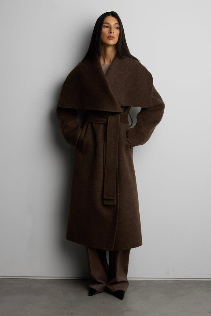 { "@context": "http://schema.org/", "@type": "Product", "name": "WOOL BLEND HANDMADE BELTED COAT", "url": "https://oakandfort.com/products/wool-blend-handmade-belted-coat-ow-16005-w", "image": [ "https://oakandfort.com/cdn/shop/files/Outerwear-16005_Cocoa-1_2400x.jpg?v=1790702373" ], "description": "Made from a wool blend, this wrap coat features a wide collar that you can button into a funnel neck silhouette. It's made in a relaxed fit and it falls loosely through the body. The belt around the waist cinches the silhouette for a more defined frame. Stay cozy and wear yours layered over your outfits this season.DETAILSWool blend. Button on collar. Waist tie.FIT & SIZING Relaxed fit 47” length based on size S Model is 5'7" and is wearing a size S ", "brand": { "@type": "Brand", "name": "Oak and Fort" }, "offers": [ { "@type" : "Offer", "availability" : "http://schema.org/InStock", "price" : "288.0", "priceCurrency" : "USD", "url" : "https://oakandfort.com/products/wo