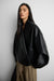 Fold-over lapel vegan leather jacket in black — main image