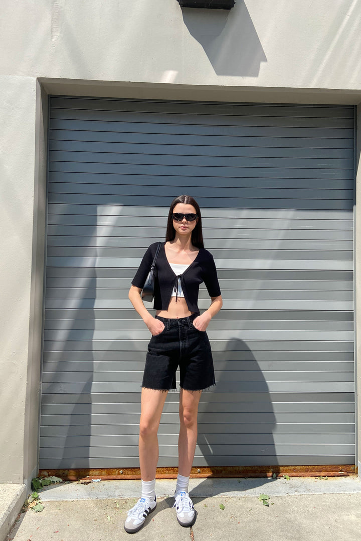 MID THIGH BLACK JEAN SHORT in Washed Black — alternate angle