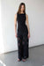 Fitted sleeveless top with asymmetrical hem in black — main image